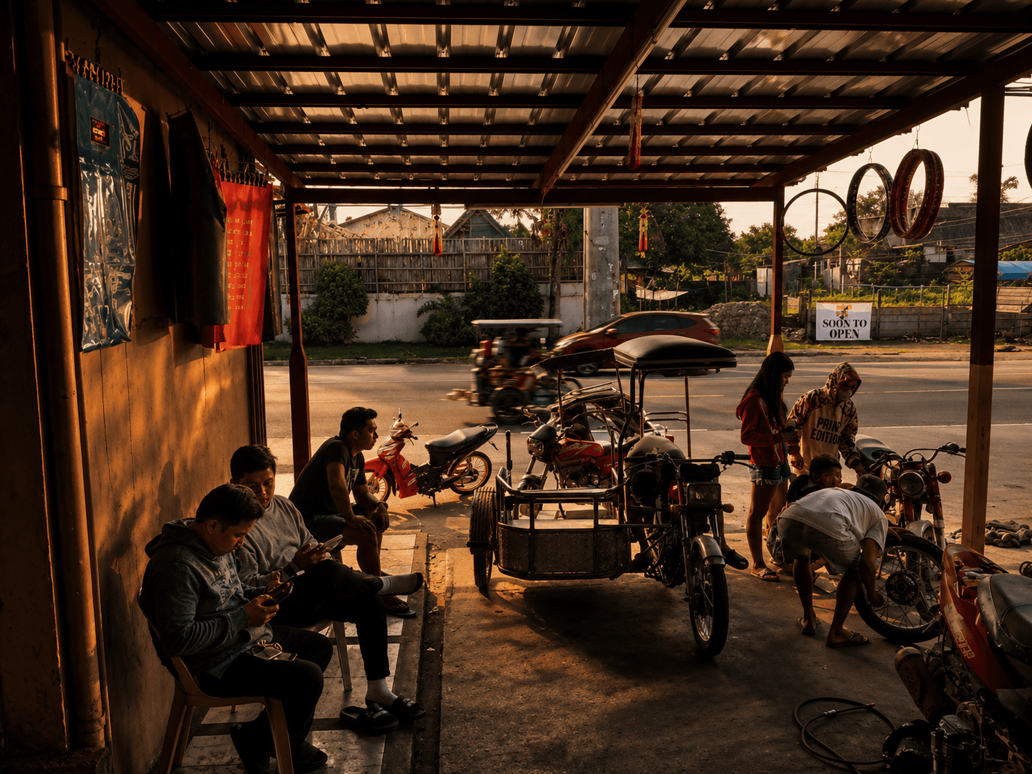 Open-air Rapido service bay at golden hour with motorcycles parked under the canopy